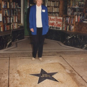 Mona Van Duyn posing in from of her St. Louis Walk of Fame star on the Delmar Loop