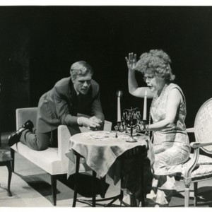 Tom Ligon and Eleanor Wilson on stage during a performance of <em>The Straw Market</em>